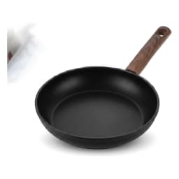 Black granite frying pan with a dark brown wooden handle, viewed from an angle on a white background. - view 2