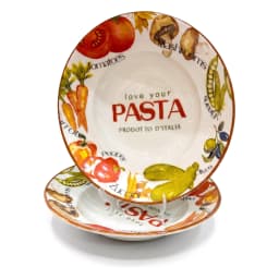 Two white porcelain pasta plates with colorful vegetable designs on the rim, filled with fettuccine pasta, on a kitchen coun… - view 2