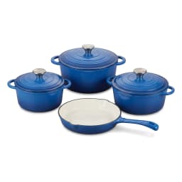 Four blue cast iron cookware pieces: three pots with lids and one frying pan, with cream interior, on a white shelf. - view 2