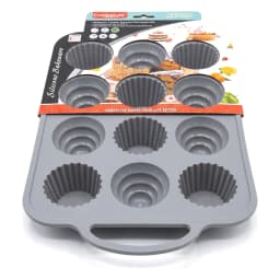 Grey silicone baking tray with 12 cavities, including 6 round and 6 fluted shapes, on a white background. - view 3