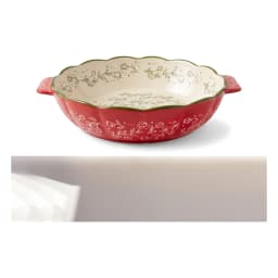 Set of three red granite oval baking dishes with white floral interior and green scalloped rim, shown on a kitchen counter. - view 5