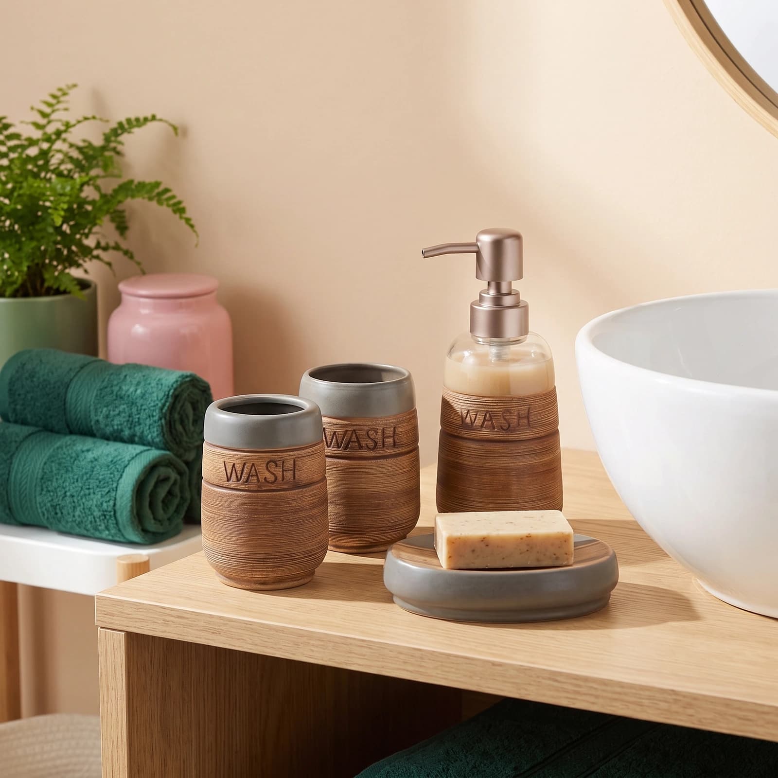 Four-piece ceramic bathroom set in grey and brown, with textured finish and 'WASH' embossed, including soap dispenser, two t…