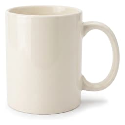 Single plain cream ceramic mug with a handle, sitting on a white shelf against a light background. - view 2