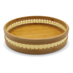 Set of three round natural light brown bamboo serving trays stacked, with perforated decorative rims on a white background. - view 3