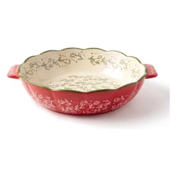Set of three red granite oval baking dishes with white floral interior and green scalloped rim, shown on a kitchen counter. - view 6