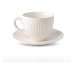 Six cream porcelain coffee cups with ribbed design and matching saucers, filled with coffee, on a rustic wooden table in a l… - view 2
