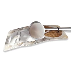Silver metal meat tenderizer with a dual-sided head and a light brown metal handle, on retail packaging. - view 2