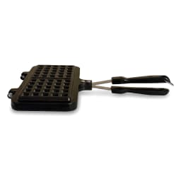Black granite stovetop waffle maker, open, showing square waffle grids and long black handles on a white background. - view 3