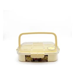 Light yellow plastic multi-compartment food storage box with clear lid and handle on a white background - view 2