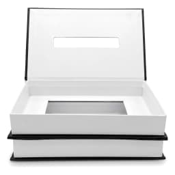 Black and white cartoon tissue box shaped like a book with 'PARIS' and flower design on a white shelf - view 3