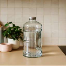 Clear Glass Bottle with Handle and Silver Lid - view 1