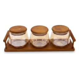 Three clear glass storage jars with round light brown wood lids, sitting on a rectangular dark brown wood tray with handles,… - view 2