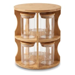 Light brown bamboo rotating two-tier stand holding six clear glass jars with light brown bamboo lids on a white surface. - view 2