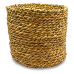 Set of three round natural light brown khous storage baskets of varying sizes on a white background. - view 3
