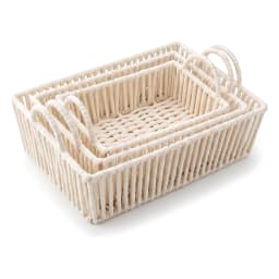 Three rectangular cream Khous storage baskets with handles, nested inside each other, on a shelf. - view 2