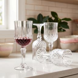 Set of 6 clear glass stemmed goblets with diamond cut pattern, shown on white background. - view 5