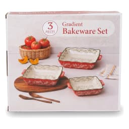 Set of 3 rectangular granite baking dishes, red exterior with white floral pattern, cream interior, on a white background. - view 2