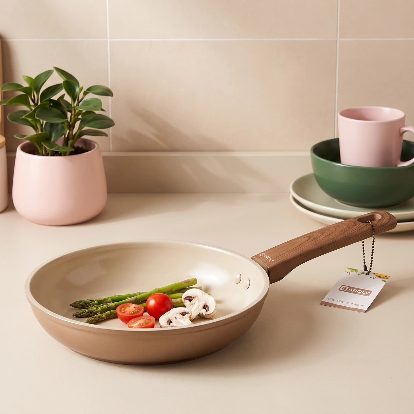 Mocha beige ceramic frying pan with a soft-touch handle, 20 cm diameter, shown with product label on a white surface.