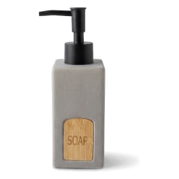 Single grey ceramic soap dispenser with a black plastic pump and a light wooden label engraved with 'SOAP' on a wooden vanit… - view 2