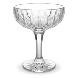 Three clear glass coupe glasses with textured bowls and starburst bases on a white background - view 2