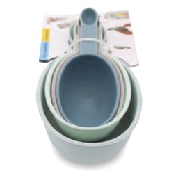Set of four nested plastic measuring cups in shades of blue, green, and grey, with handles, on a white background. - view 2