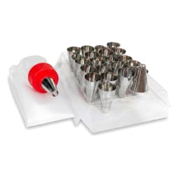 Boxed set of 25 silver metal cake decorating nozzles, a white piping bag, and a coupler, displayed on a shelf. - view 3