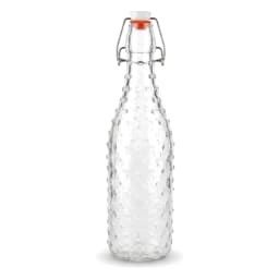 Single clear glass bottle with a textured bumpy surface and a white and orange swing top lid, on a white shelf. - view 2