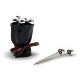 Six silver metal fruit forks with spherical tops in a black ceramic holder, tied with a white ribbon, on a white background. - view 2
