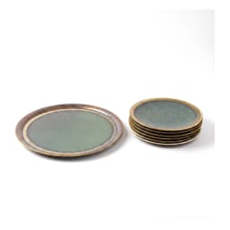 Two round deep blue ceramic plates with rustic gold rims, one large with a carrot cake, one small with a slice, on a white c… - view 5