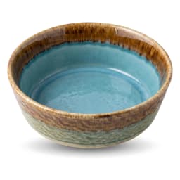 Round porcelain bowl with blue reactive glaze interior and brown and green textured exterior on a white background. - view 4