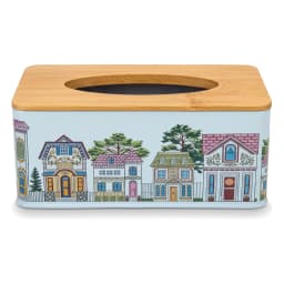 Rectangular light blue metal tissue box with colorful house design and natural wood top, on a wooden coffee table. - view 3