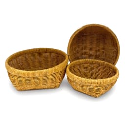 Three oval khous storage baskets in natural yellowish-brown color, varying in size, on a white background. - view 4