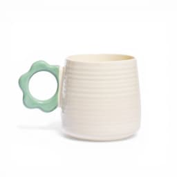Cream ceramic mug with horizontal ridges and a bright yellow flower-shaped handle on a white background. - view 4