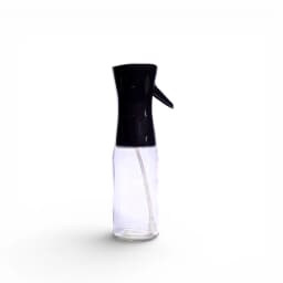 Clear glass oil spray bottle with a black plastic pump top and white internal tube on a white background. - view 2