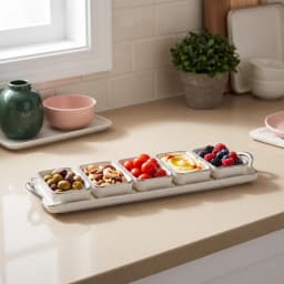 Cream porcelain serving set with five square bowls and a rectangular tray, all with silver trim, on a white background. - view 1