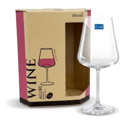 One clear glass wine glass standing next to its brown cardboard box with wine glass illustration and '2 pcs' label on a whit… - view 3