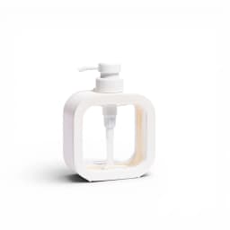 White plastic square-shaped dispenser bottle with a clear inner container and a white pump on a white background - view 2