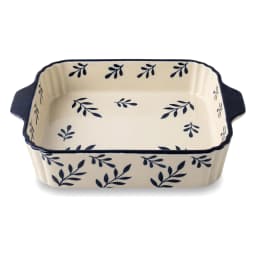 Rectangular porcelain baking dish, cream with navy blue leaf pattern and fluted sides, on a white background. - view 3