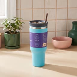 Aqua blue stainless steel tumbler with a dark lid, blue flip-top, and brown straw on a white surface. - view 5
