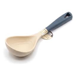 Beige silicone ladle with a dark blue handle, featuring a hanging hole, on a white background. - view 2