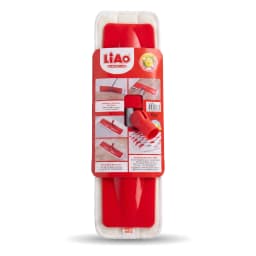 Red plastic rotatable mop head refill with white microfiber pad in packaging, on a wooden surface. - view 2