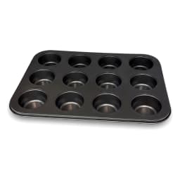 Dark grey 12-cup non-stick metal muffin and cupcake baking pan on a white shelf - view 3