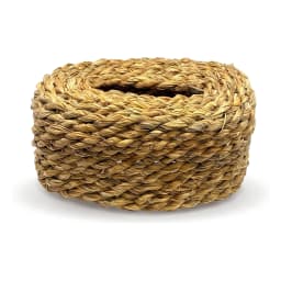 Close-up of a round, cylindrical tissue box cover made from natural light brown woven khous on a white background. - view 2