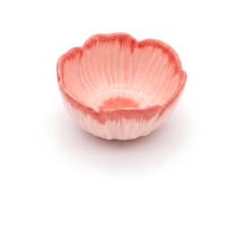 Pink porcelain bowl with a fluted flower petal design, filled with colorful fruit salad, on a light kitchen counter. - view 3