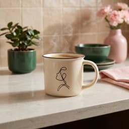 Single cream ceramic mug with black rim and black minimalist line art drawing of a face in profile on a white background - view 1