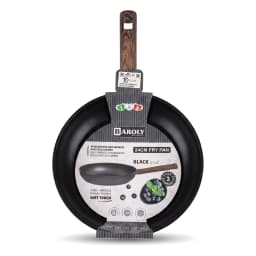 Black granite frying pan with a dark wooden handle, cooking cherry tomatoes and mushrooms with steam rising, on a white kitc… - view 3