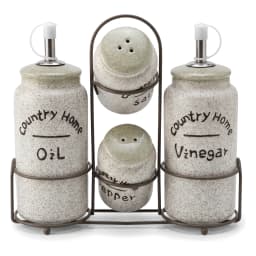 Five-piece porcelain oil, vinegar, salt, and pepper shaker set with a metal stand. Cream speckled body, light green tops. - view 2