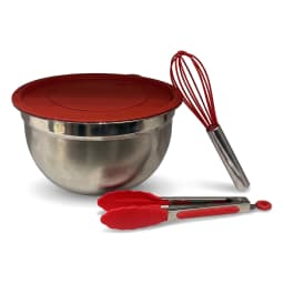 Stainless steel mixing bowl with red whisk and red lid on a light kitchen counter, next to a pink potted plant. - view 5