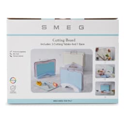 Three pastel plastic cutting boards (pink, green, blue) with grey edges, stored vertically in a white holder with metal hand… - view 3