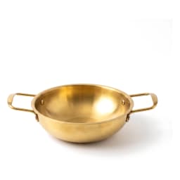Steaming gold-tone stainless steel cooking pot with two handles, filled with chicken and vegetable curry on a kitchen counte… - view 2